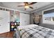 Comfortable bedroom with ceiling fan, hammock chair, and playful decor, creating a cozy atmosphere at 105 Coogler Way, Brooks, GA 30205