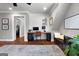 Open concept bonus room features hardwood floors, built-in desk, and comfortable seating area at 105 Coogler Way, Brooks, GA 30205