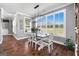 A dining room with modern light fixture and a large window looking out to the property at 105 Coogler Way, Brooks, GA 30205