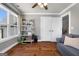 Bright living room with hardwood floors, built-in shelving, and natural light through large windows at 105 Coogler Way, Brooks, GA 30205