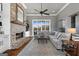 Cozy living room with a brick fireplace, built-in shelving, and comfortable seating at 105 Coogler Way, Brooks, GA 30205