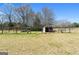 Fenced pasture area with shelter, ideal for livestock and offers space for outdoor activities at 105 Coogler Way, Brooks, GA 30205