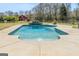 A gorgeous in-ground pool with a stacked stone water feature at 105 Coogler Way, Brooks, GA 30205