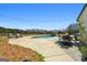 Backyard pool area featuring a dining set and lounge chairs for outdoor relaxation at 105 Coogler Way, Brooks, GA 30205
