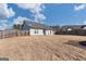 Large backyard enclosed by a wooden fence offers privacy and space for outdoor activities at 243 Summergate Ln, Villa Rica, GA 30180