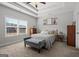 This bedroom features a cozy bed, a tray ceiling, and a large window at 243 Summergate Ln, Villa Rica, GA 30180