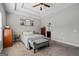 This bedroom features a cozy bed, a tray ceiling, and a large window at 243 Summergate Ln, Villa Rica, GA 30180