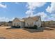 Well-kept home with a manicured lawn and attractive architectural details under a blue sky with clouds at 243 Summergate Ln, Villa Rica, GA 30180