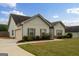 Well-maintained home featuring an attached garage and a nicely landscaped yard with lush greenery at 243 Summergate Ln, Villa Rica, GA 30180
