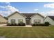 Charming single-story home featuring a manicured lawn and beautifully landscaped front yard at 243 Summergate Ln, Villa Rica, GA 30180