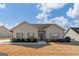 Charming single-story home with light-colored siding, decorative shutters, and well-maintained landscaping at 243 Summergate Ln, Villa Rica, GA 30180