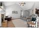 Cozy living room with a fireplace, comfortable seating, and stylish decor throughout at 243 Summergate Ln, Villa Rica, GA 30180