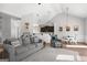 Open-concept living room with dining space, filled with natural light and modern decor at 243 Summergate Ln, Villa Rica, GA 30180