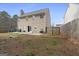 Spacious backyard featuring a patio, fenced yard, and mature trees at 85 Clairidge Ln, Lawrenceville, GA 30046