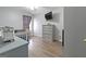 Neutral bedroom boasts hard floors, a large dresser, and an entertainment center at 85 Clairidge Ln, Lawrenceville, GA 30046