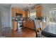 Well-equipped kitchen with stainless steel appliances, light wood cabinets, and hardwood floors provides ample storage and workspace at 85 Clairidge Ln, Lawrenceville, GA 30046