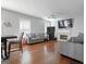Spacious living room with hardwood floors, a cozy fireplace, and large windows that bring in lots of natural light at 85 Clairidge Ln, Lawrenceville, GA 30046