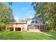 Backyard showcasing a spacious deck, a screened patio and lush greenery, perfect for outdoor enjoyment at 1343 Burbank Trl, Morrow, GA 30260