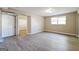 Basement featuring wood-look flooring, a large closet, and a bright window at 1343 Burbank Trl, Morrow, GA 30260