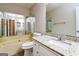Bathroom featuring a jacuzzi tub, granite countertop vanity, and large mirror at 1343 Burbank Trl, Morrow, GA 30260