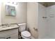 Clean bathroom featuring a granite countertop vanity and white-tiled shower at 1343 Burbank Trl, Morrow, GA 30260
