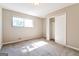 Bedroom featuring neutral walls, natural light, and a spacious closet at 1343 Burbank Trl, Morrow, GA 30260