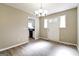 Dining room featuring hardwood flooring and a view into the kitchen area at 1343 Burbank Trl, Morrow, GA 30260