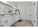This bathroom offers double sinks, lots of storage, tiled floor, and glass enclosed shower at 415 Discovery Lake Dr, Fayetteville, GA 30215