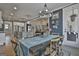Bright dining room features hardwood floors, natural light, and access to kitchen at 415 Discovery Lake Dr, Fayetteville, GA 30215