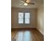 Inviting bedroom with hardwood floors and large window, offering natural light at 242 12Th St Ne 1 1A, Atlanta, GA 30309