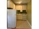 Compact kitchen featuring essential appliances and white cabinetry for a functional cooking space at 242 12Th St Ne 1 1A, Atlanta, GA 30309