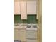 Kitchen featuring classic white cabinetry, laminate countertops, and modern appliances at 242 12Th St Ne 1 1A, Atlanta, GA 30309