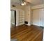 Spacious living room featuring hardwood floors, built-in shelving, and ample natural light at 242 12Th St Ne 1 1A, Atlanta, GA 30309