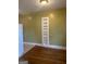 Living room with built-in shelving and hardwood flooring, providing a flexible living space at 242 12Th St Ne 1 1A, Atlanta, GA 30309
