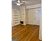 Bright living room with hardwood floors, built-in shelving, and neutral walls, awaiting personal touches at 242 12Th St Ne 1 1A, Atlanta, GA 30309