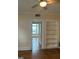 Living room boasting polished hardwood floors, built-in shelving, and plenty of natural light at 242 12Th St Ne 1 1A, Atlanta, GA 30309