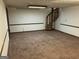 View of the basement with brown carpet and spiral staircase at 1288 Lakewood Ne Dr, Conyers, GA 30013