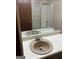 Bathroom showcasing a vanity with single sink, toilet, and bathtub/shower combo at 1288 Lakewood Ne Dr, Conyers, GA 30013