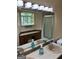 Bathroom showcasing a vanity with dual sinks and mirrored wall, and a shower in the background at 1288 Lakewood Ne Dr, Conyers, GA 30013