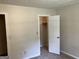 Cozy bedroom includes a closet with open door allowing for extra storage at 1288 Lakewood Ne Dr, Conyers, GA 30013