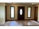 Welcoming foyer with tile flooring, decorative front door, and natural light at 1288 Lakewood Ne Dr, Conyers, GA 30013