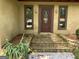 Charming front entrance with stone steps, stucco exterior, and decorative door at 1288 Lakewood Ne Dr, Conyers, GA 30013