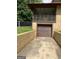 Driveway leading to garage and a glimpse of the screened-in back porch at 1288 Lakewood Ne Dr, Conyers, GA 30013