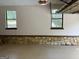 Garage with stone foundation and two double hung windows at 1288 Lakewood Ne Dr, Conyers, GA 30013