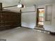 Large residential garage with epoxy flooring and garage door opener at 1288 Lakewood Ne Dr, Conyers, GA 30013