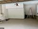 Residential garage with epoxy flooring, sink, and garage door opener at 1288 Lakewood Ne Dr, Conyers, GA 30013