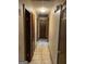 Hallway boasts tile floors and multiple doors accessing various rooms at 1288 Lakewood Ne Dr, Conyers, GA 30013