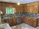 Galley kitchen with stainless steel dishwasher and double basin sink at 1288 Lakewood Ne Dr, Conyers, GA 30013