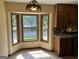 Bright eat-in kitchen with bay window and granite countertops at 1288 Lakewood Ne Dr, Conyers, GA 30013
