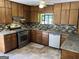 Galley kitchen with stainless steel gas range at 1288 Lakewood Ne Dr, Conyers, GA 30013